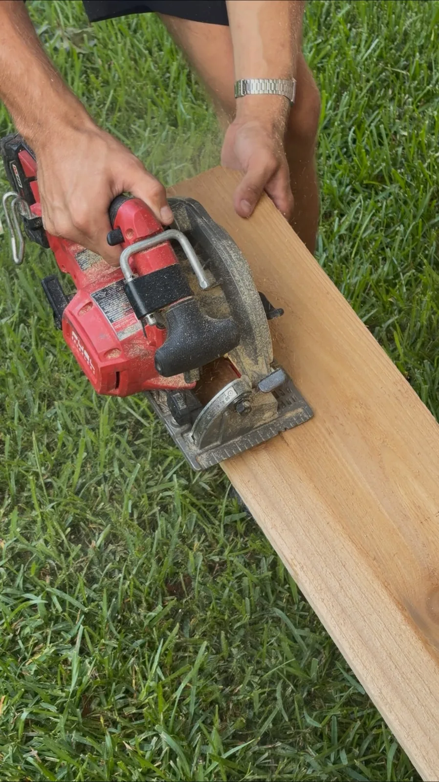 Geaux Cajun crew member preparing a fence board